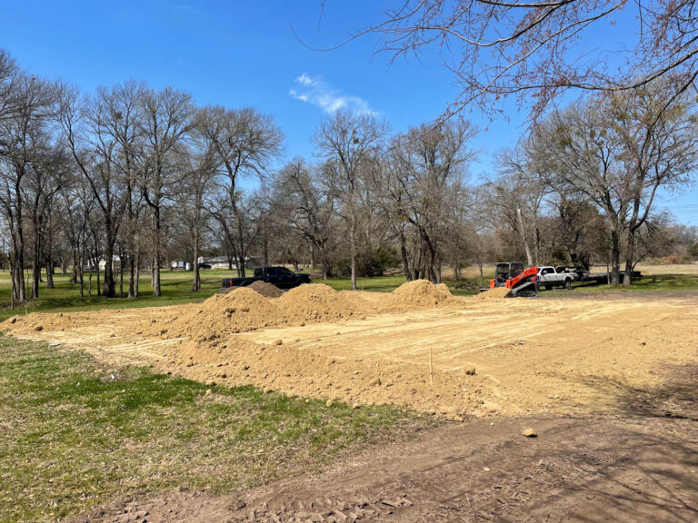 Cleared building site with dirt piles ready for a new home