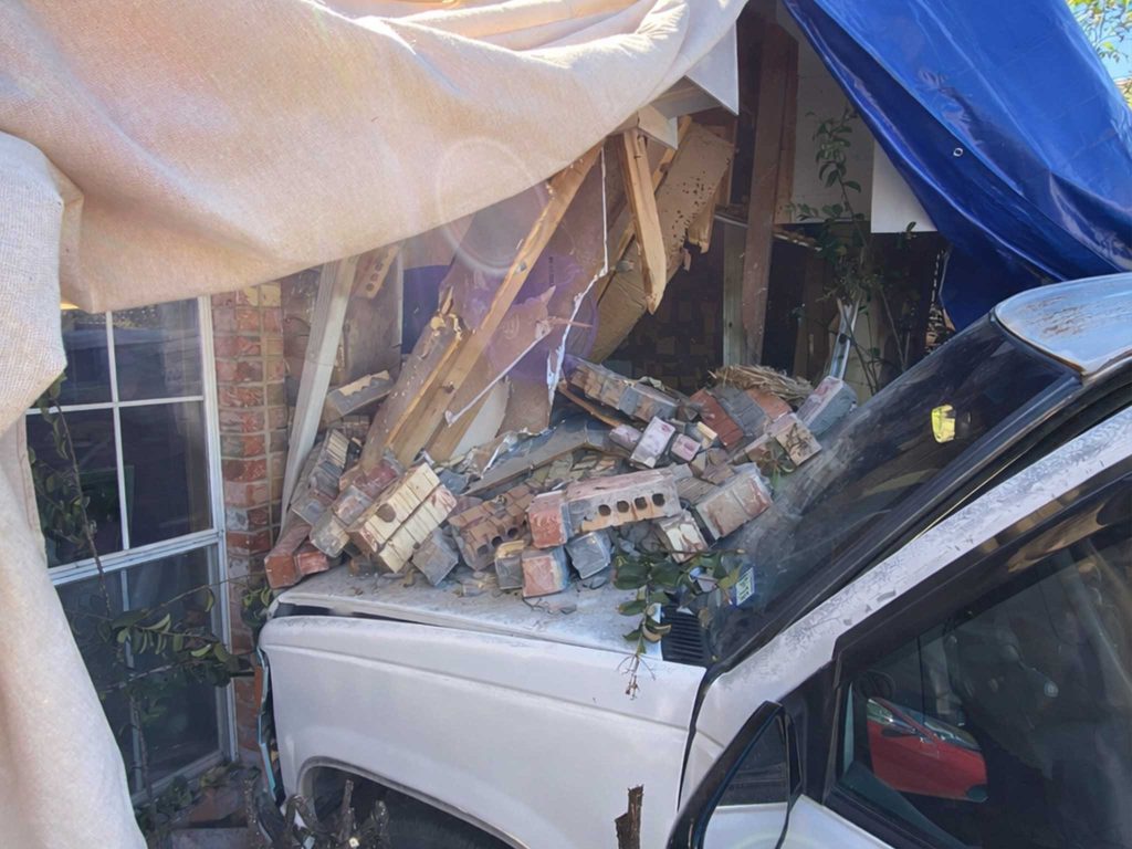 Vehicle crashed through a brick home wall, before damage repairs