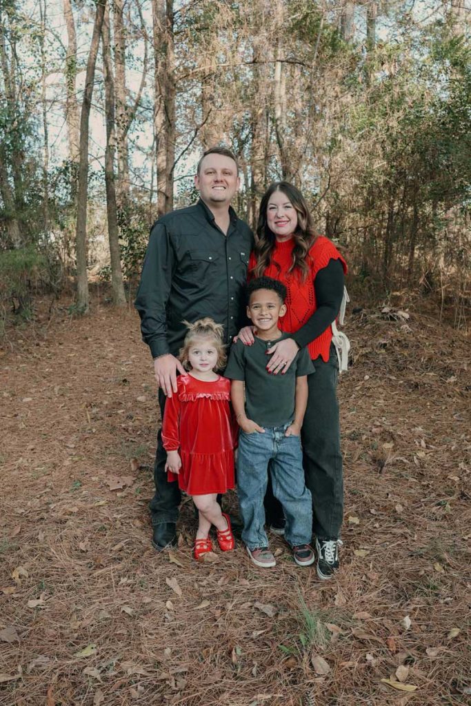 Jay Walden and his family outdoors among the trees