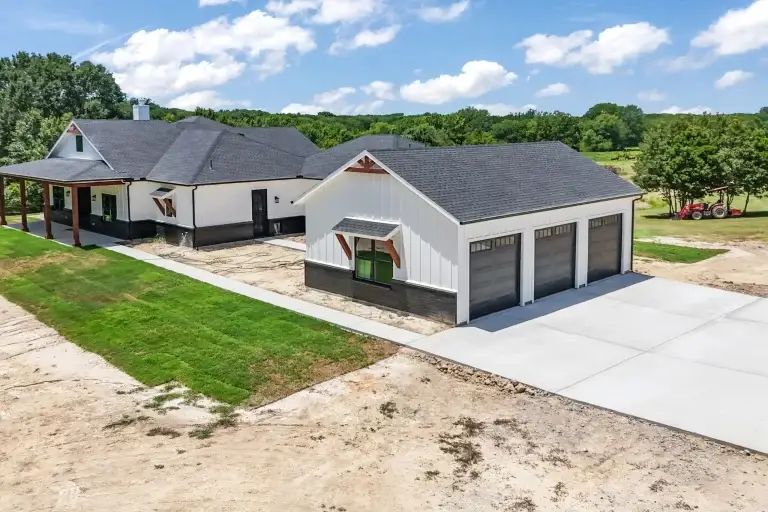 Detached three-bay garage and concrete drive