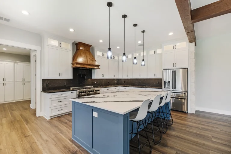 Kitchen with copper hood and blue island