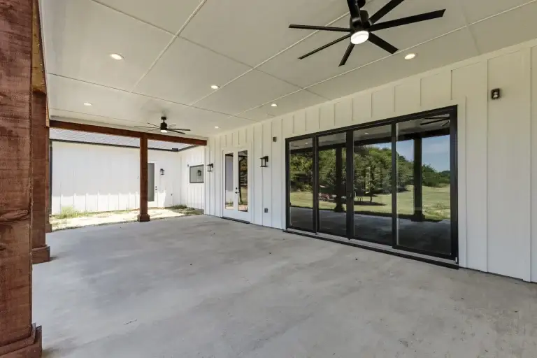 Covered back porch with sliding glass wall