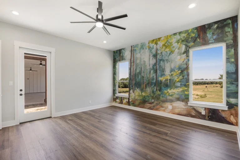 Room with a hand-painted landscape mural
