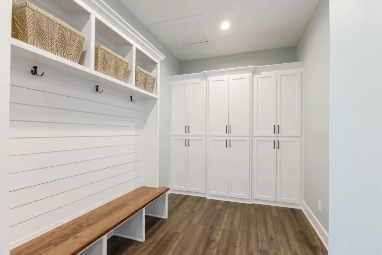 Mudroom with built-in lockers and bench