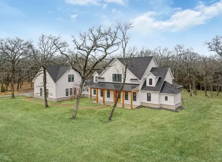 Aerial view of the Duke farmhouse among the trees in Quinlan