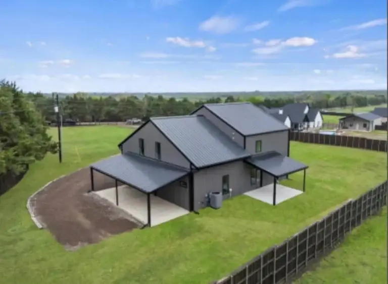 Aerial view of the two-story barndominium on 1.5 acres in Greenville